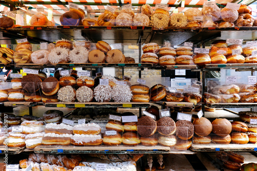 Variety of doughnuts on a market stall in a small street in Camden Town, London, Fototapeta