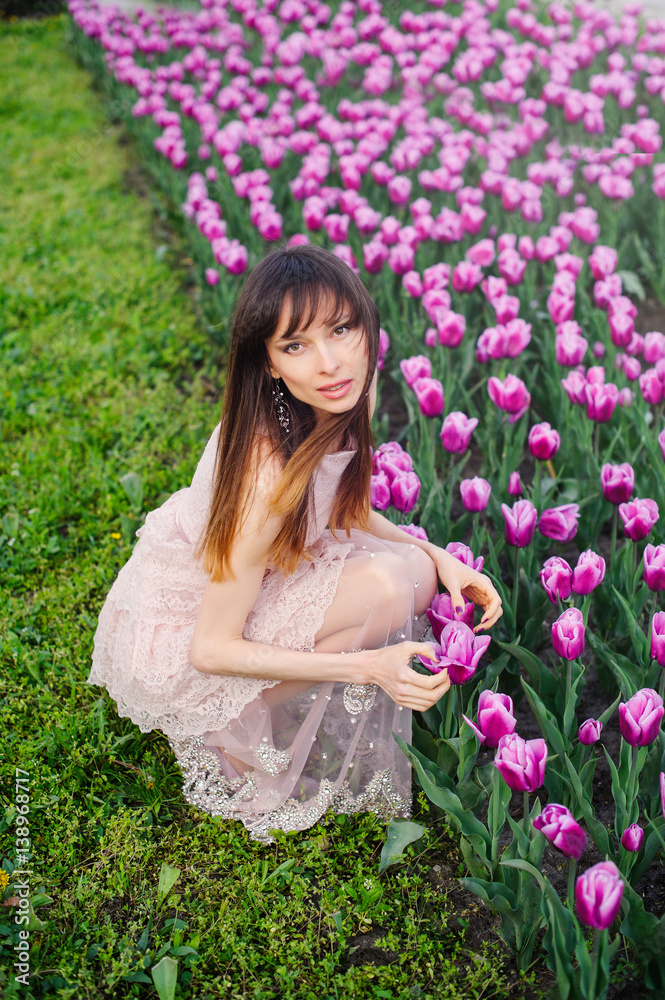 beautiful woman in a field of tulips beautiful woman in a field of tulips