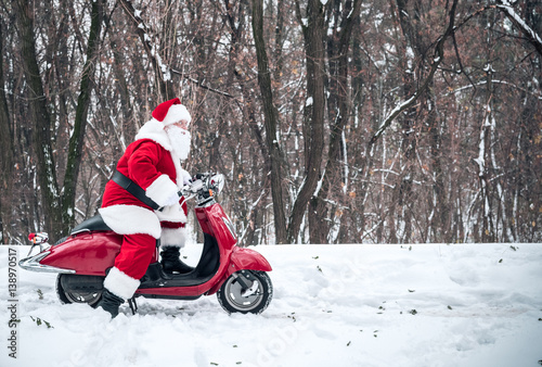 Santa Claus riding on scooter