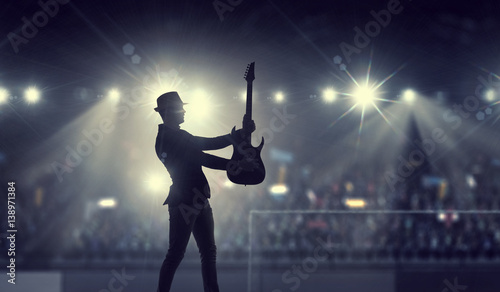 Elegant guitarist silhouette . Mixed media © Sergey Nivens