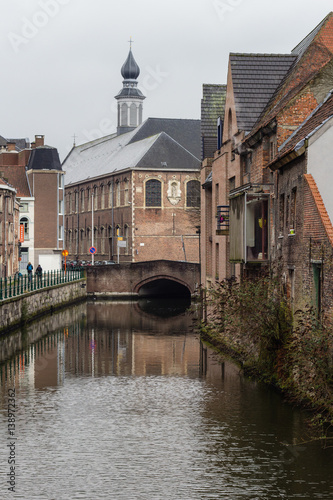 View of canals and streets of Gent town, Belgium in rainy day in winter