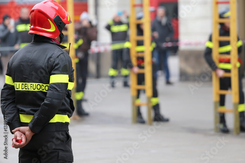 Italian firefighters with protective helmet during outdoor exerc