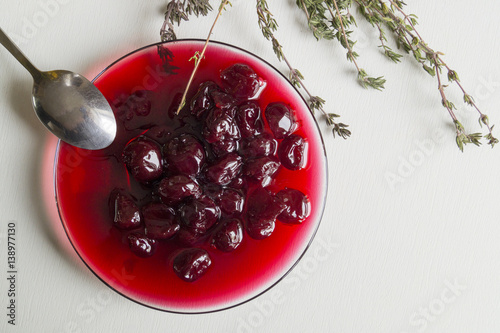 cherry jam on a white background. free prostranstvo right for text photo