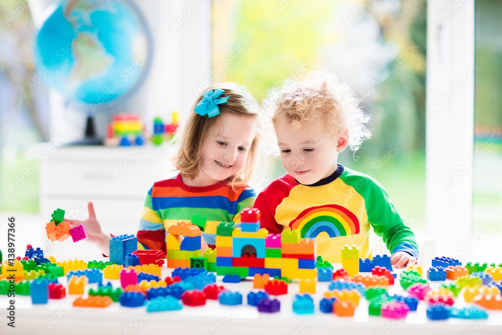 Fototapeta premium Kids playing with colorful blocks