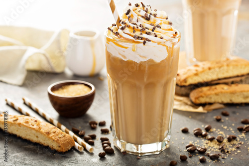 Iced caramel latte coffee in a tall glass Fototapeta