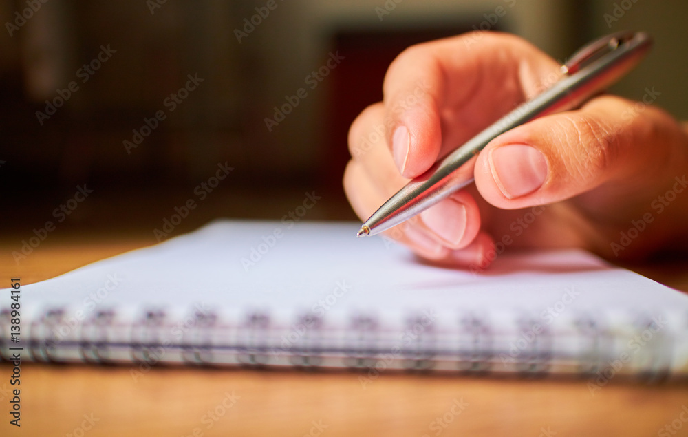 write with a pen in a notebook write with a pen in a notebook