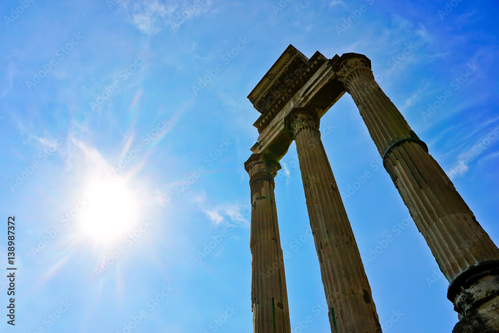 View of the columns of roman ruins in a sunny day in Rome, Italy. View of the columns of roman ruins in a sunny day in Rome, Italy.