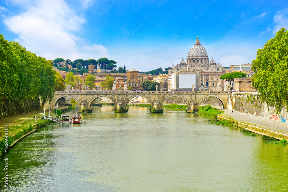 View of St. Peter's Basilica and Aelian Bridge across Tiber River in Rome 