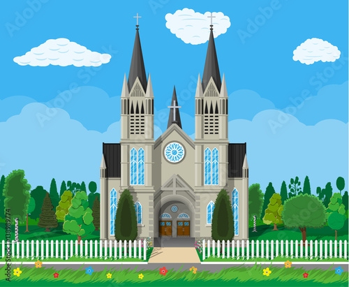 Catholic church cathedral with trees and fence