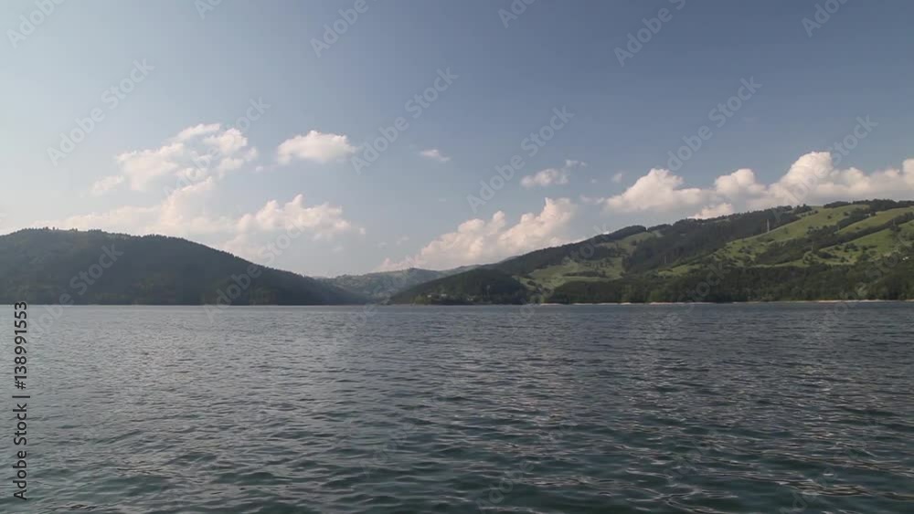 View on a lake and hills in the background. View on a lake and hills in the background.