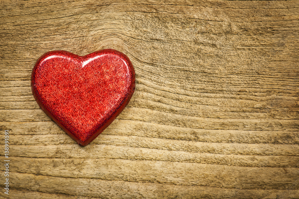 Red heart chocolate on old wooden background Red heart chocolate on old wooden background