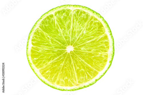 Half section of green lemon isolated over white