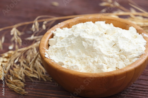 Flour in bowl with grain ears