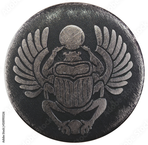 Scarabaeus carved in silver coin isolated on white background