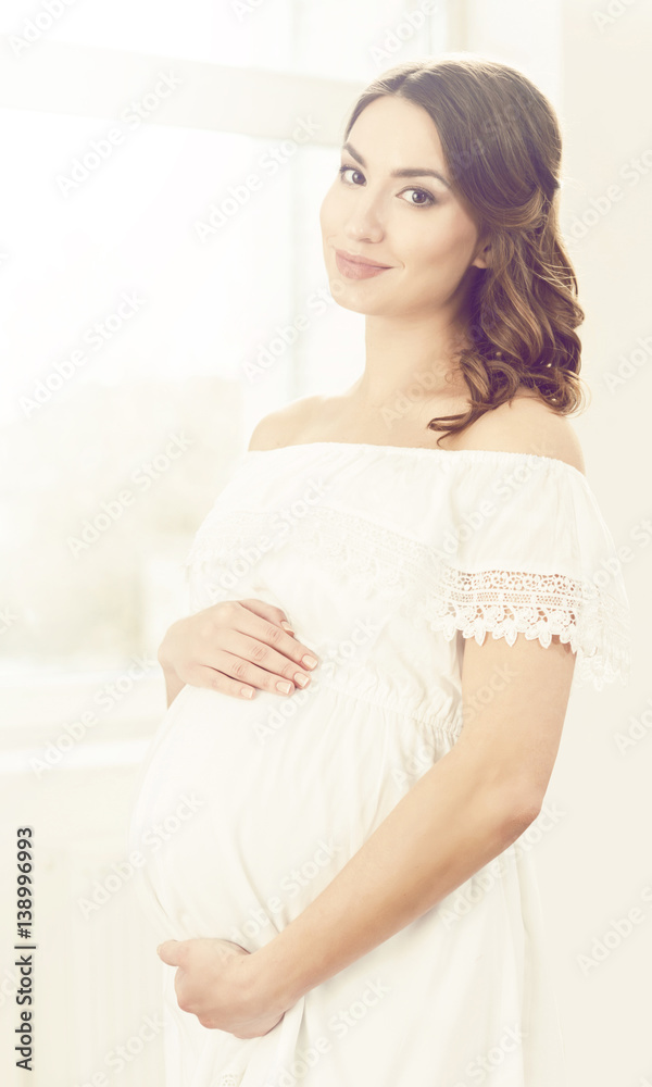 Beautiful pregnant woman in white dress. Motherhood, pregnancy, maternity concept. Beautiful pregnant woman in white dress. Motherhood, pregnancy, maternity concept.