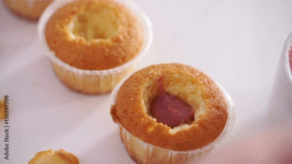girl chef puts berry fillings in biscuit cupcakes girl chef puts berry fillings in biscuit cupcakes