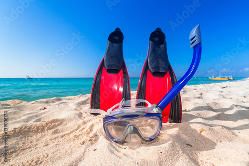 Snorkeling mask and fins on the tropical beach photo