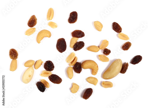 Healthy food, pile of mixed nuts, cashews, peanuts, hazelnut, raisins, brazilian nut, almond, isolated on white