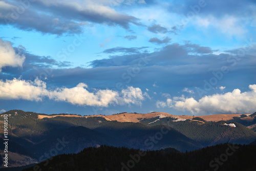 Fototapeta Naklejka Na Ścianę i Meble -  Beautiful view of the blue winter mountains and hills in Carpathians on the sunrise