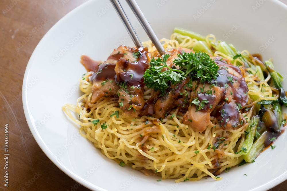chinese noodle with sweet red pork on the table chinese noodle with sweet red pork on the table
