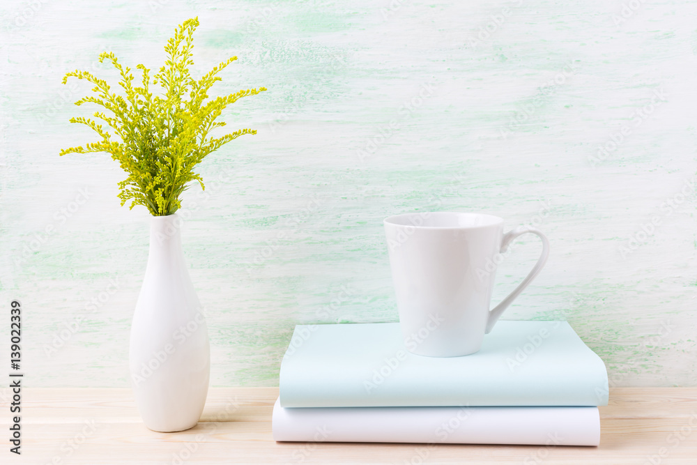 White coffee latte mug mockup with ornamental green grass White coffee latte mug mockup with ornamental green grass