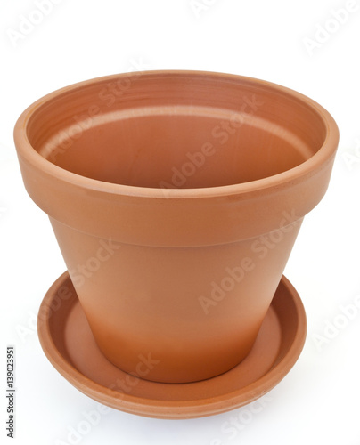 Isolated terracotta pot and dish.