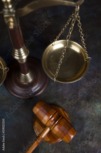 Law theme, mallet of the judge, wooden desk background