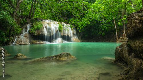 Green nature with green waterfall landscape  Erawan waterfall located Khanchanaburi Province  Thailand