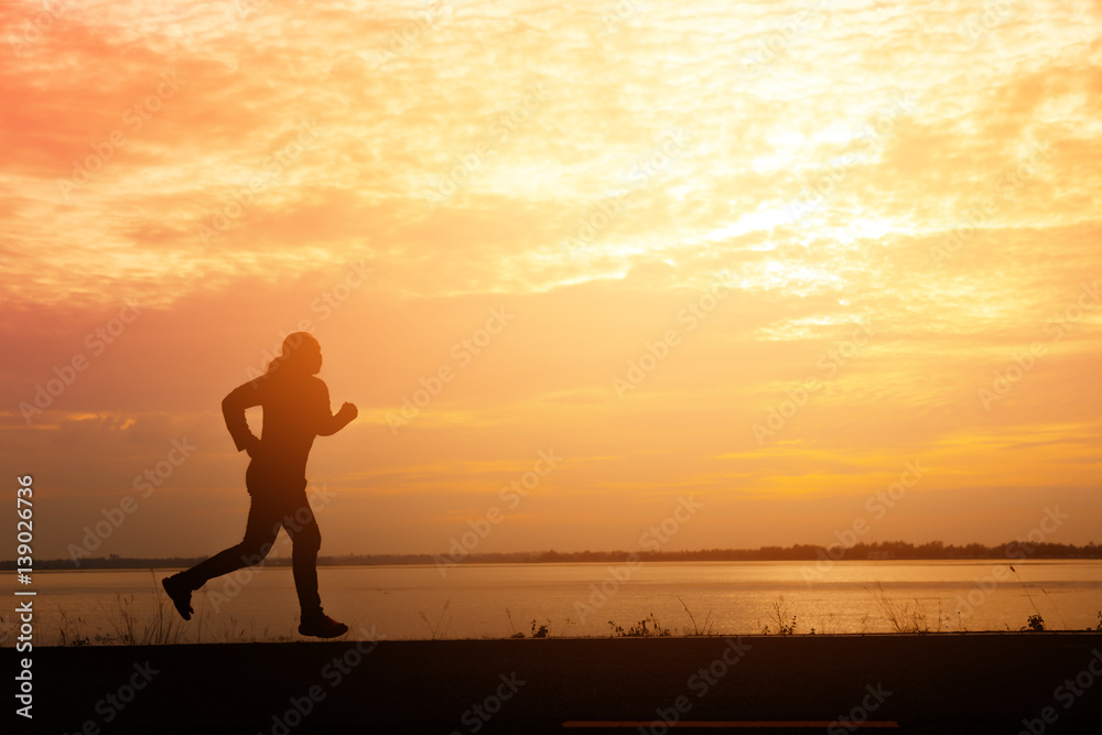 Silhouette man relaxing by running