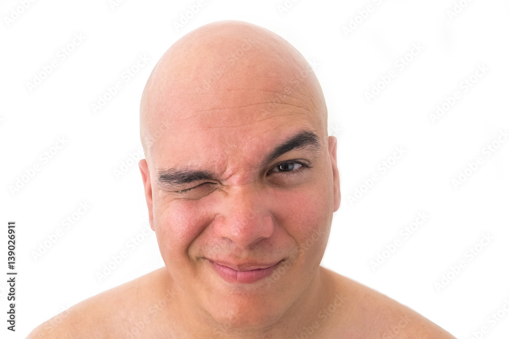 Obraz premium Face of a bald man in white background. Suspicious face.