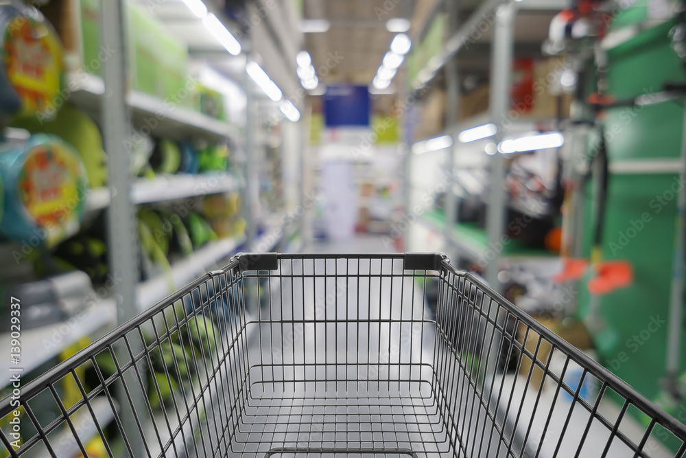 Abstract blurred photo of store with trolley in department store bokeh background,Shopping cart in supermarket and Home Hardware and furniture Stores Abstract blurred photo of store with trolley in department store bokeh background,Shopping cart in supermarket and Home Hardware and furniture Stores