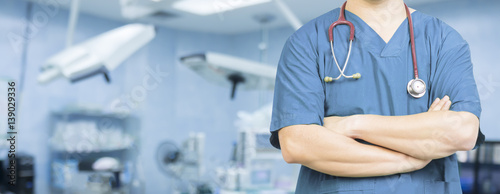  Medical ,Doctor surgeon posing with arms crossed in an operating theatre,surgical room,doctor with operating room,healthcare and medical concept,stethoscope,medical,healtcare ,background banner