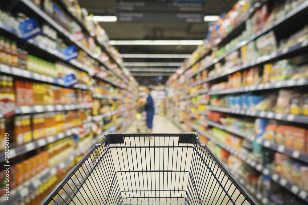 Abstract blurred photo of store with trolley in department store bokeh background,Shopping cart in supermarket and Home Hardware and furniture Stores