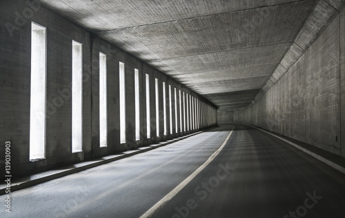Empty tunnel with asphalt road 