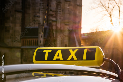 Taxi Symbol Sign Call Sunset Flare Outdoors European Travel Tourism Car Roof Yellow Black