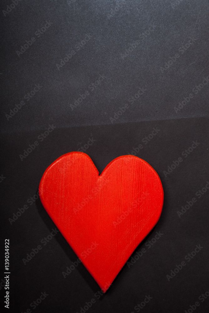 Holidays gift and heart on a black background. Valentines day Holidays gift and heart on a black background. Valentines day