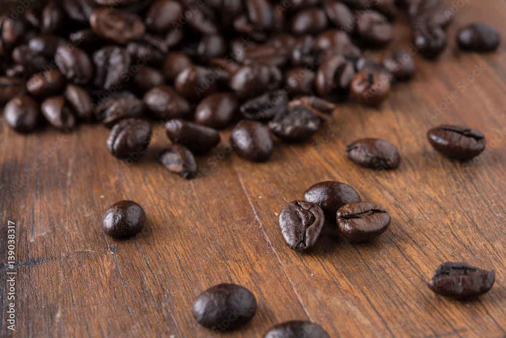 Coffee beans on old wood Coffee beans on old wood