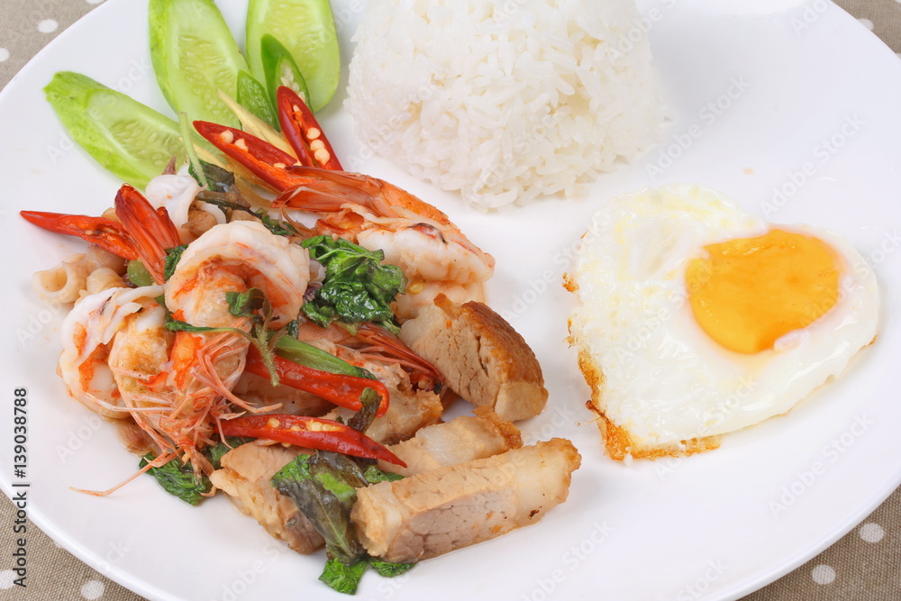 Jasmine rice topped stir - fried spicy basil with meat. Jasmine rice topped stir - fried spicy basil with meat.