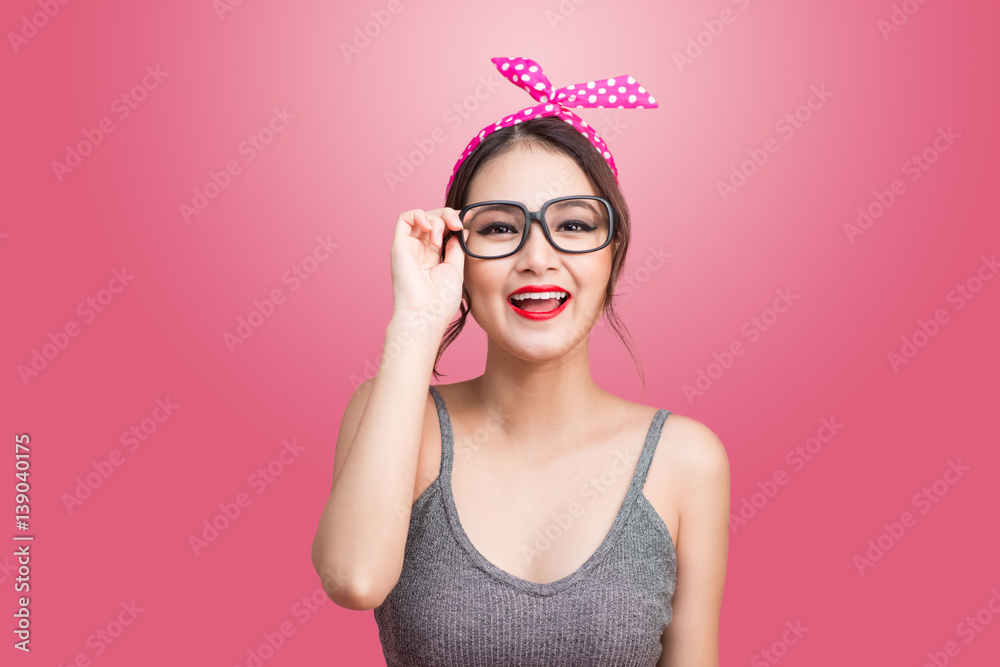 Fashion portrait of asian girl with sunglasses standing on pink background. Fashion portrait of asian girl with sunglasses standing on pink background.