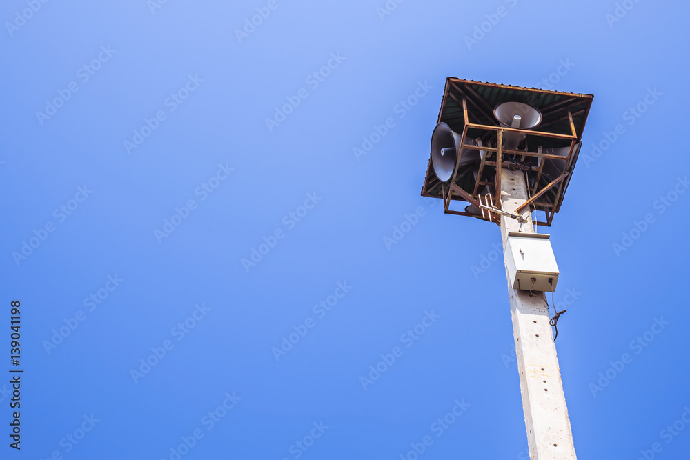 Loudspeaker outdoor Community radio broadcasting on blue sky Loudspeaker outdoor Community radio broadcasting on blue sky