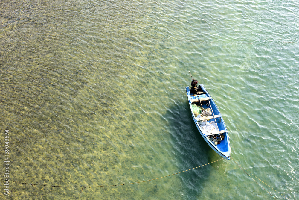Fototapeta premium Lonely boat in a sea from Top view at Rameswaram, Tamilnadu India. 