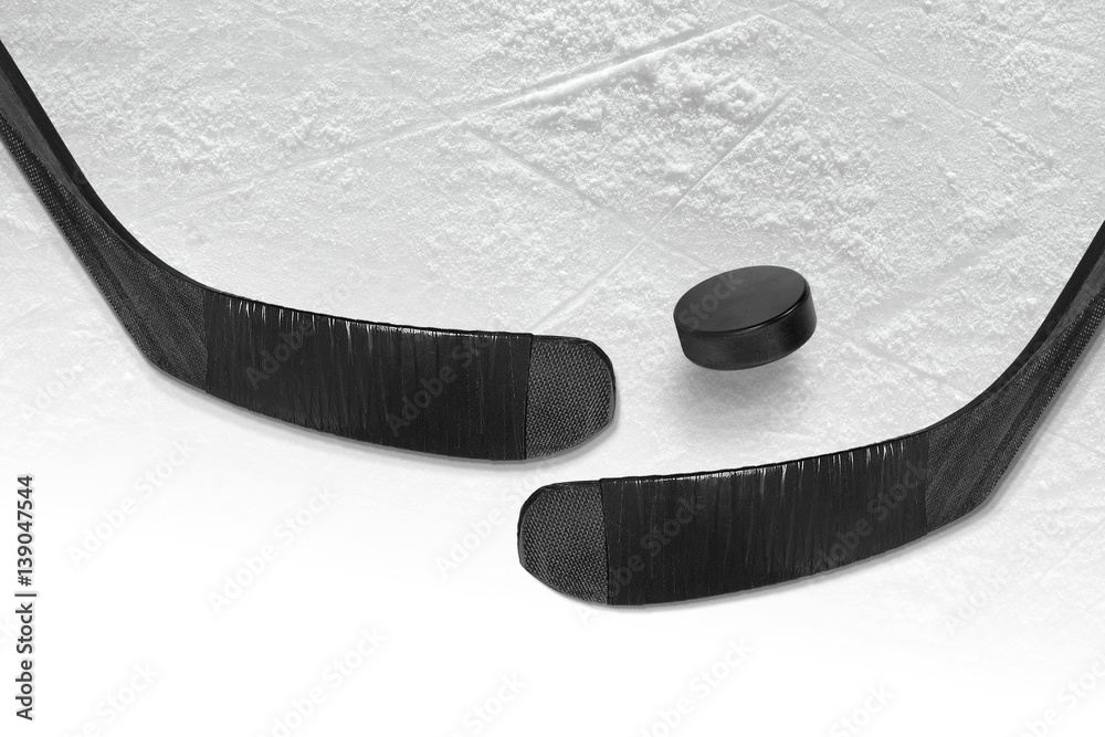 Fototapeta premium Hockey puck and stick two black ice