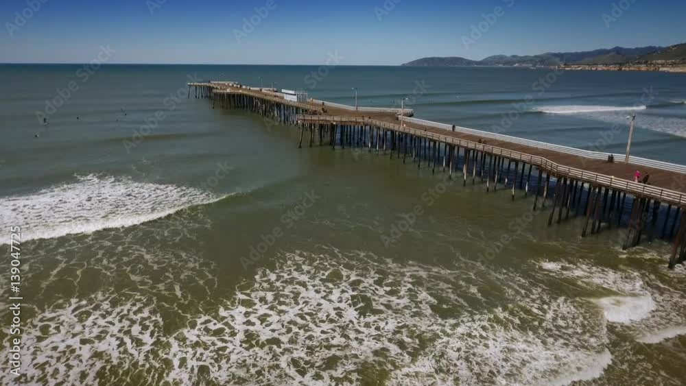 Aerial View of Pismo Beach Pier and Ocean with Surfers Aerial View of Pismo Beach Pier and Ocean with Surfers