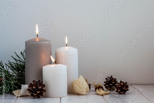 Christmas candles and lights on a old wooden table.