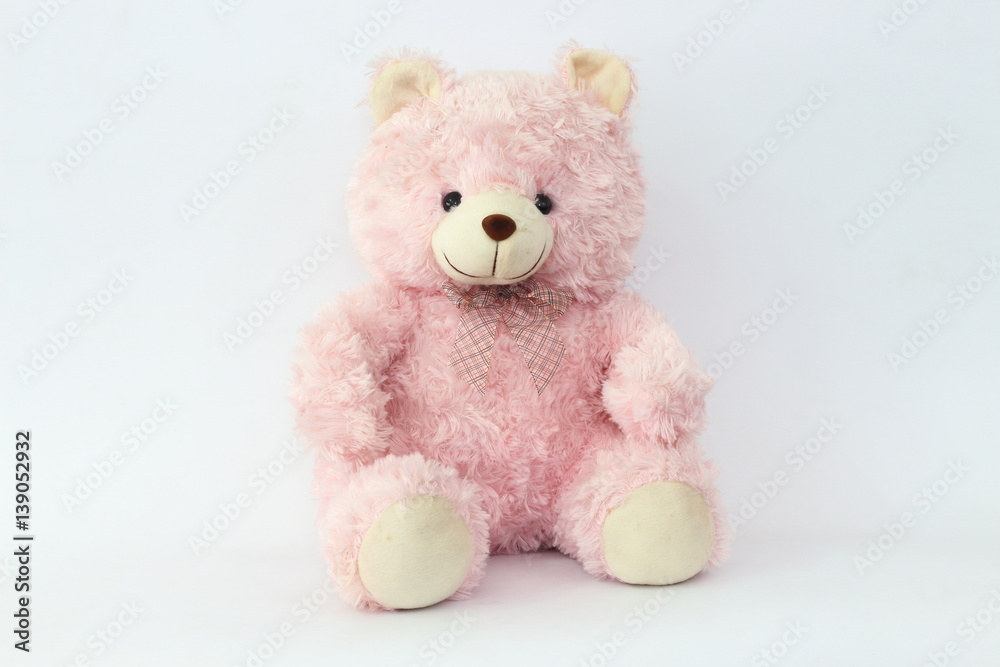 Pink teddy bear on a white background.