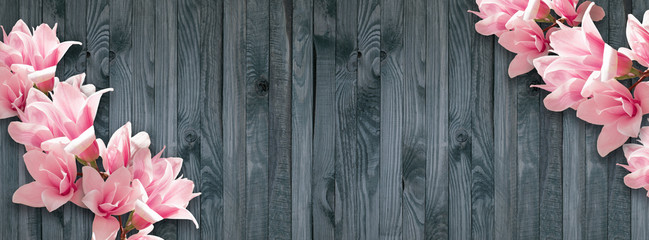 Background with magnolia flowers on wall of wooden planks