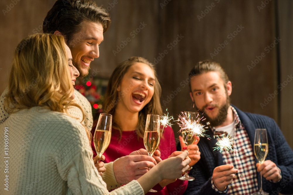 People with champagne and sparklers People with champagne and sparklers