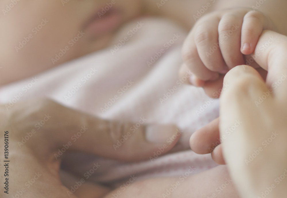 Father and mother are taking care of their child. Father and mother are taking care of their child.