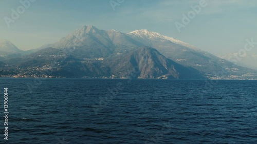 Panoramic view of Lake Como, the Alps above it and the nature around it. photo