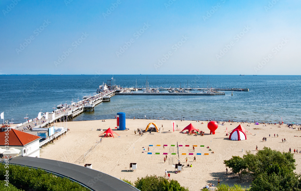Fototapeta premium Sopot, Poland. Wooden pier (molo), beach and Baltic Sea